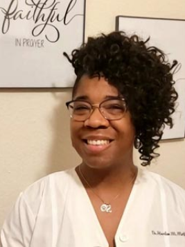 Dr. Harlem Motley smiling in a professional portrait